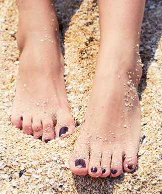 Feet in sand.